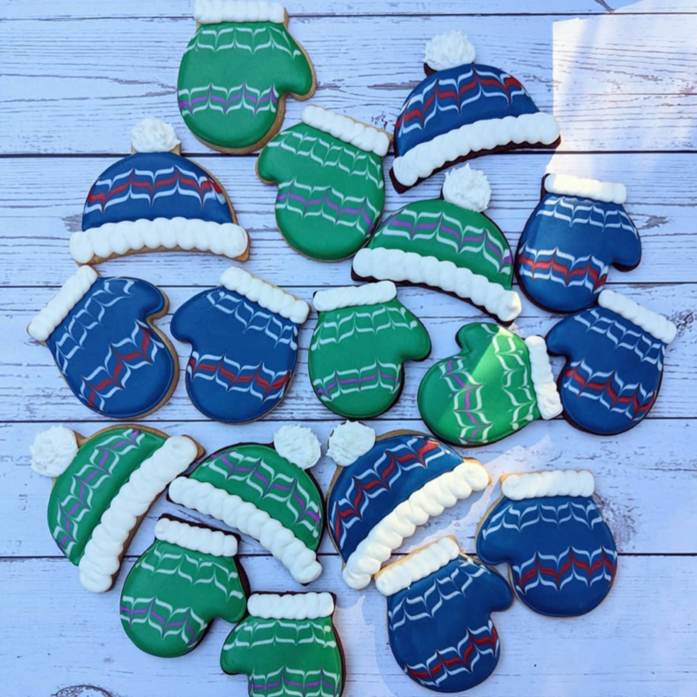 Cookies decorated like winter beanies and mittens